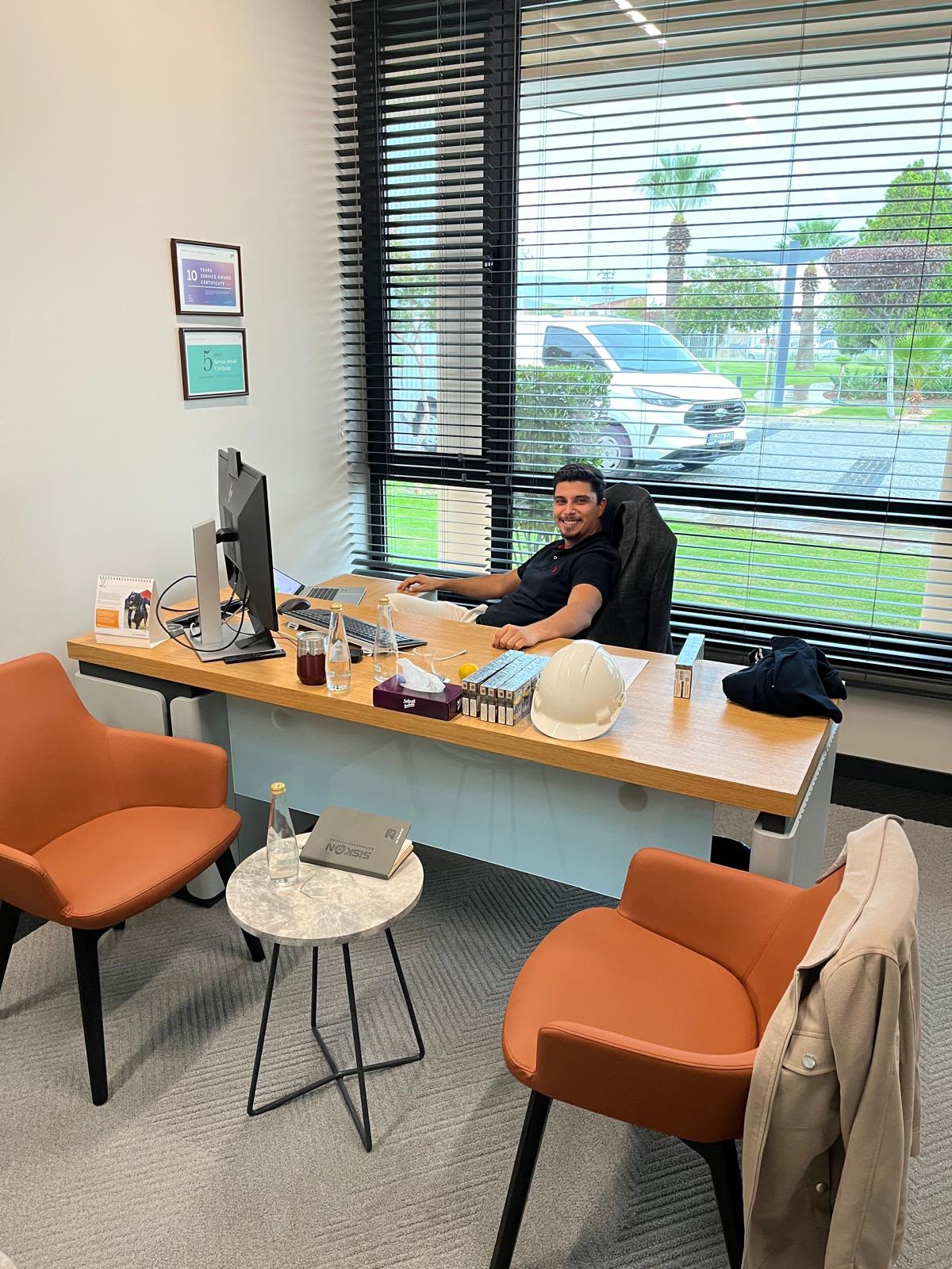 Ege Mert Arsali at an engineering office desk